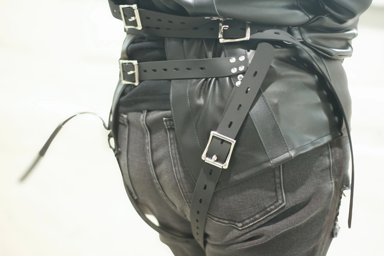 Asylum Adventurer side detail showing the sleeve, waist straps, buckles, and rivets.