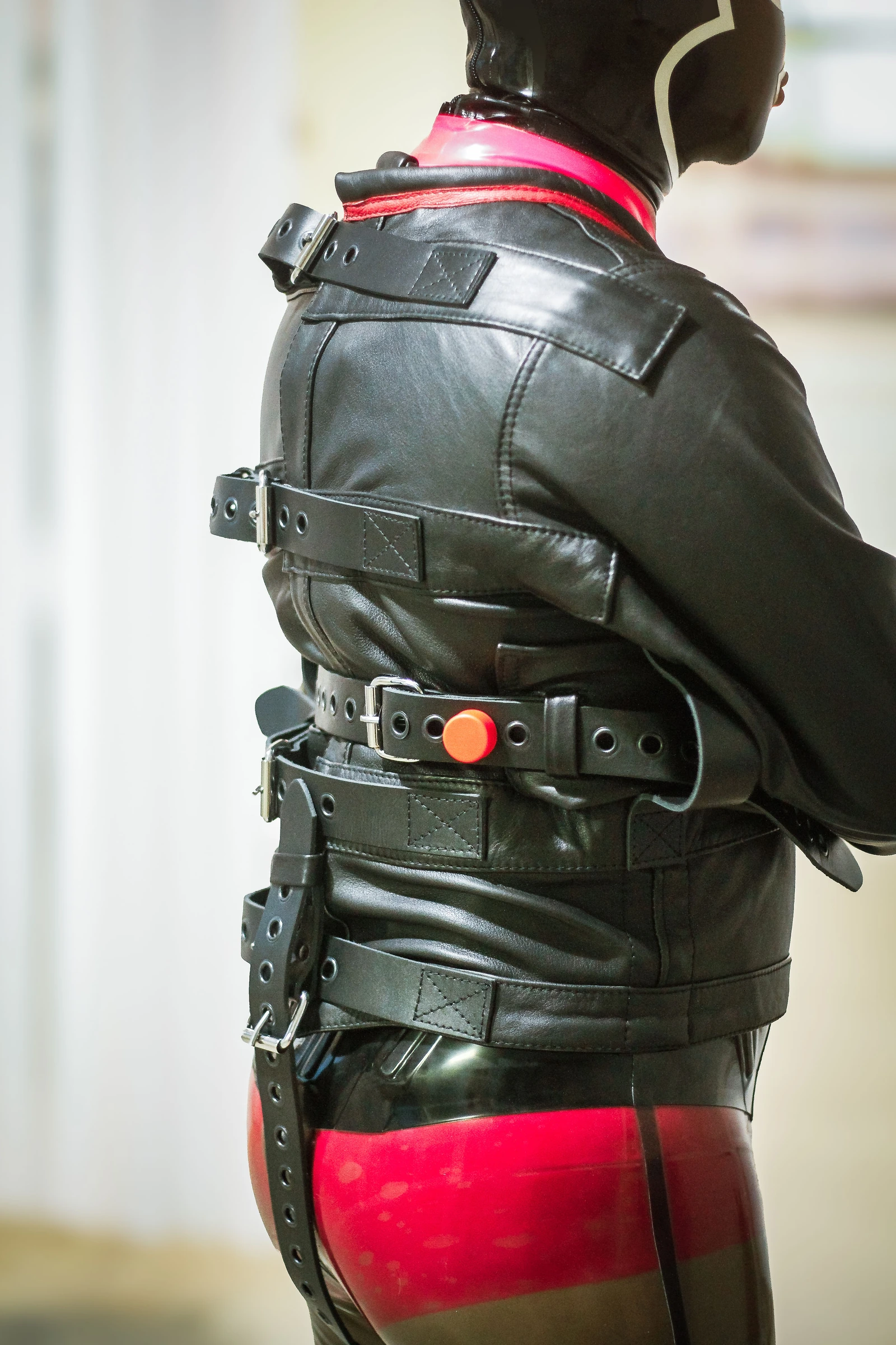 Rear view of the Leather Posey Replica showing back straps and a color-coded collar.