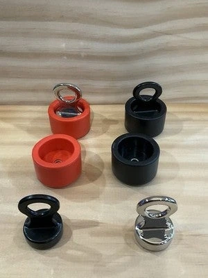 Red, black, and chrome SEGUFIX-style pin locks with removable protective covers.